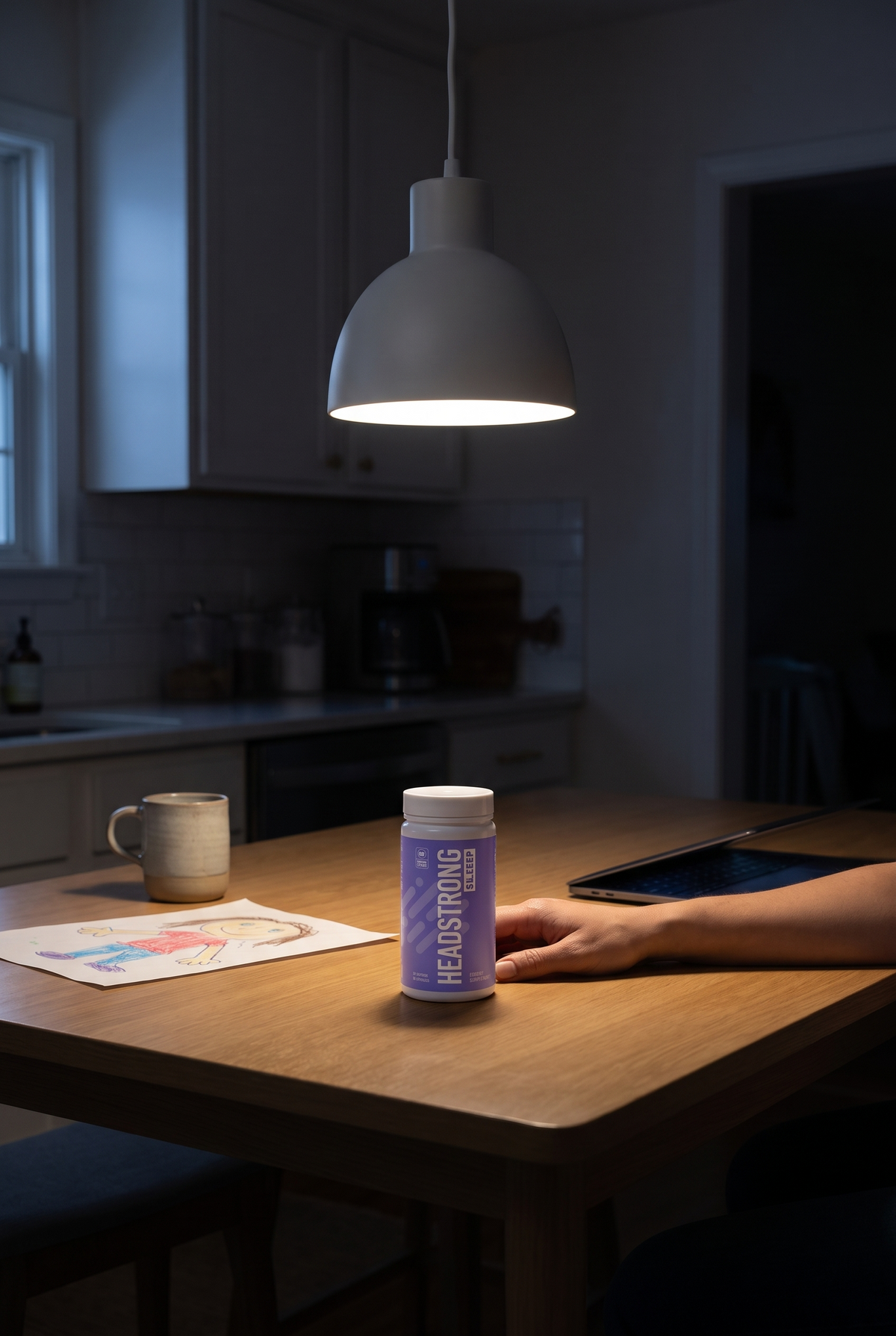 Headstrong SLEEP on a kitchen table late at night
