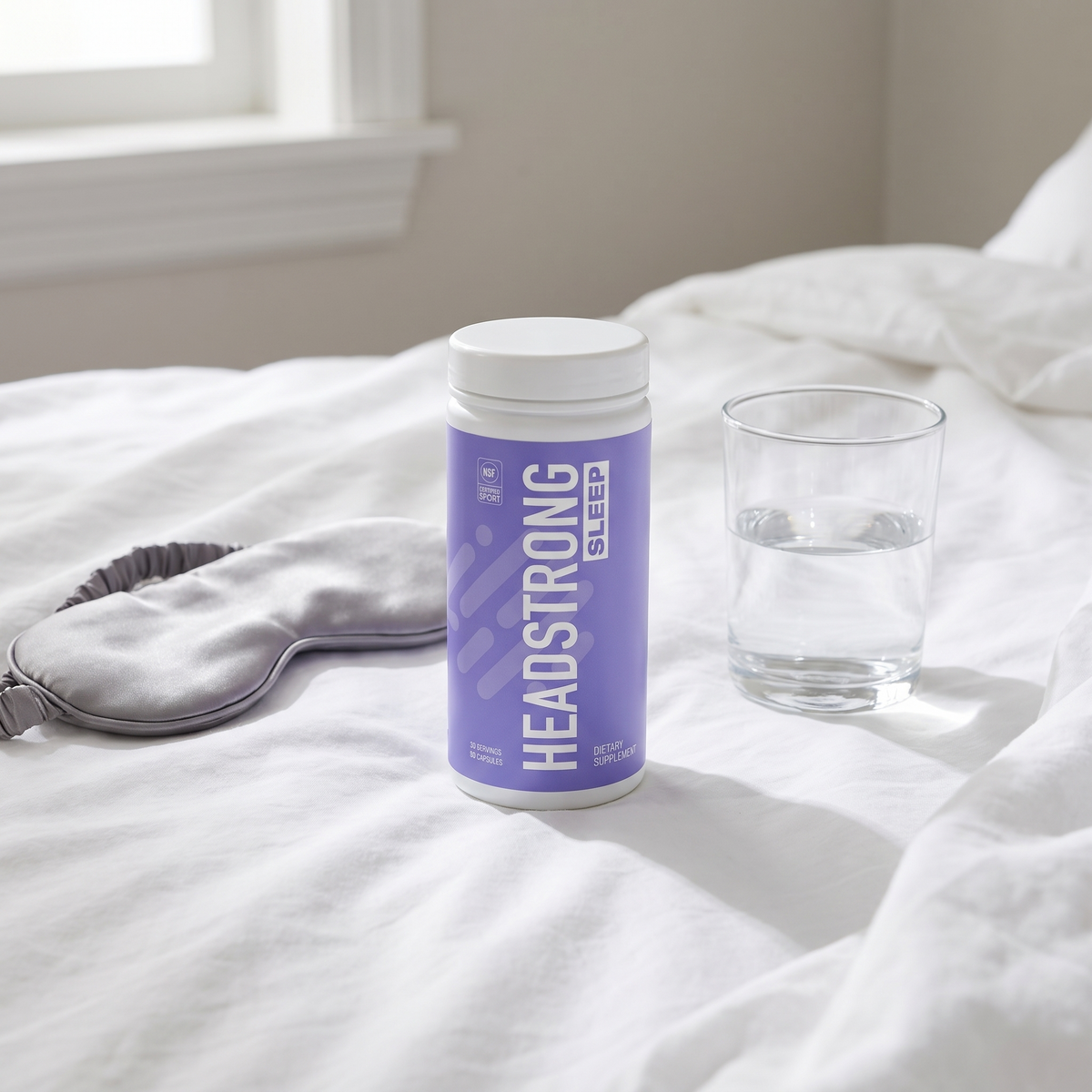 Headstrong SLEEP on white bed linen